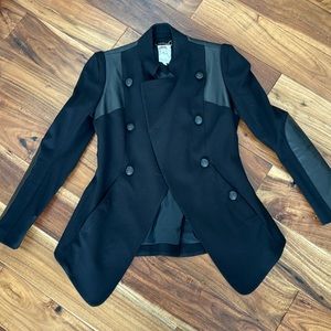 Absolutely gorgeous stylish blazer. Black fabric with leather combination